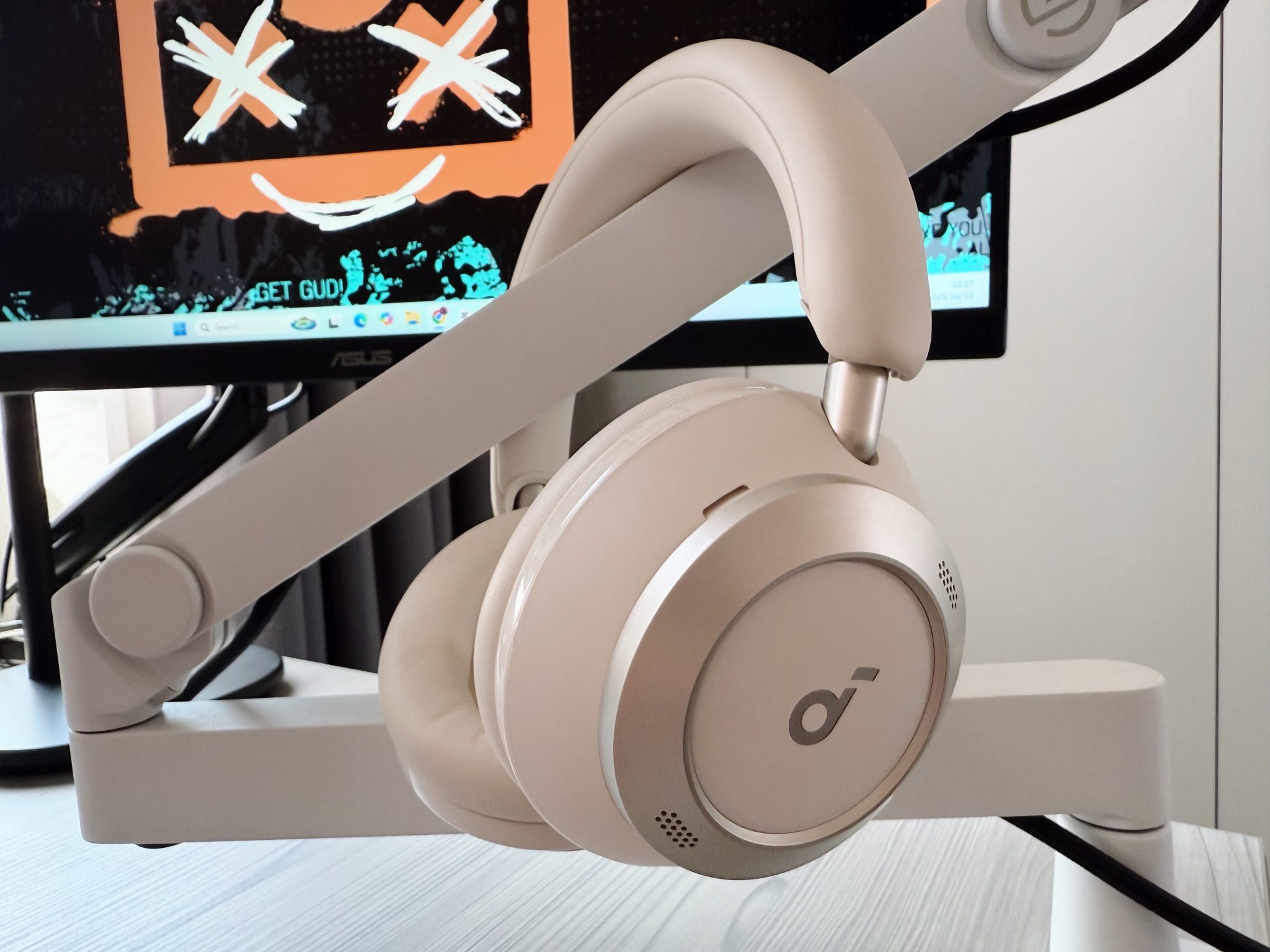 Person wearing Soundcore Space One Pro headphones while working on a laptop, demonstrating comfort.