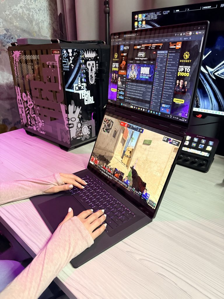 ASUS Zephyrus Duo running Counter-Strike stream on top screen and HLTV match stats on bottom screen